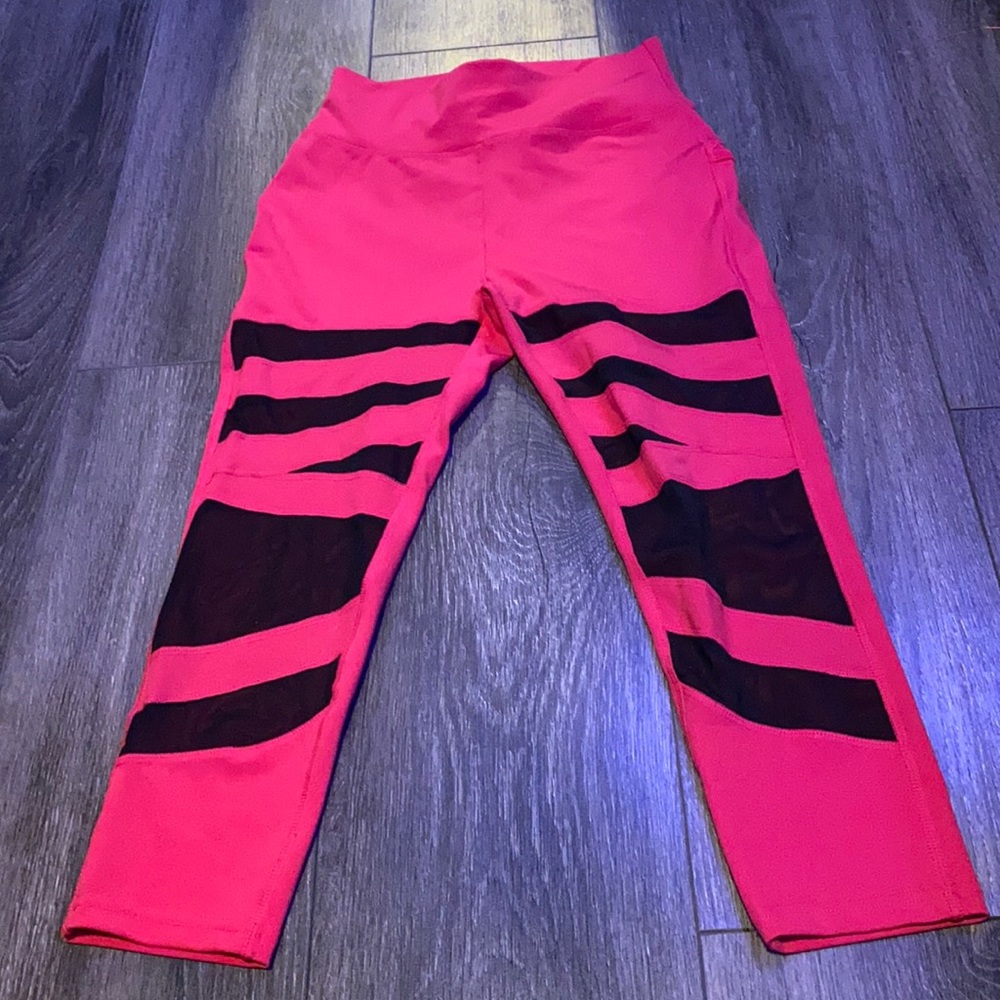 Pink capris with black cut outs on the thighs